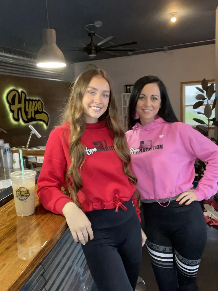 Reba and a crew member at the counter