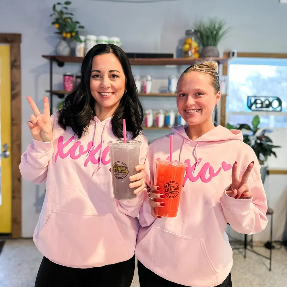 Two Hype crew members in pink hoodies