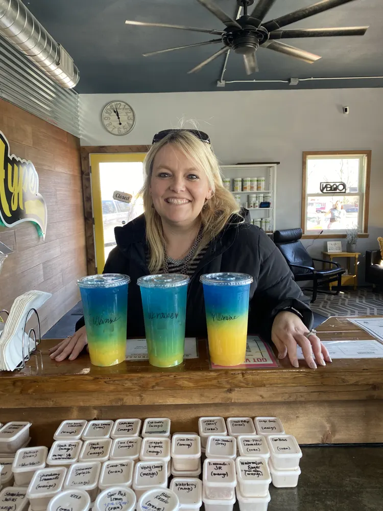 A customer with three layered Hype drinks