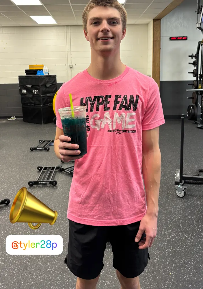 A Hype Fan of the Game in his pink shirt with a Hype drink