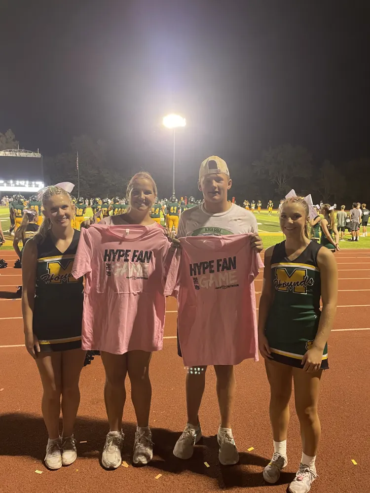 Hype Fans of the Game with cheerleaders at a football game