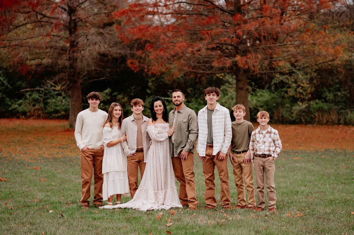 Jake, Reba and their six kids in a fall family portrait